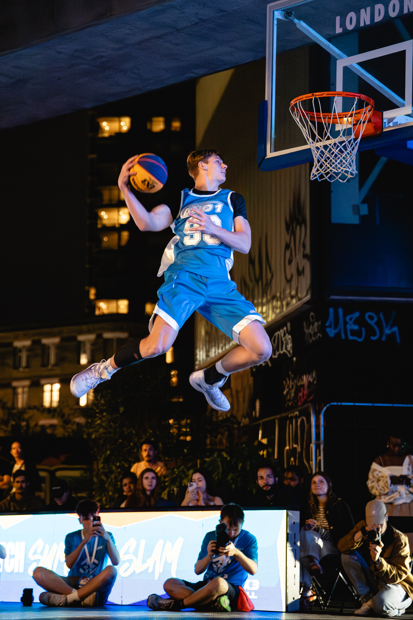 Cam Hazzard cocking back a dunk mid-air at Rise 3x3 London