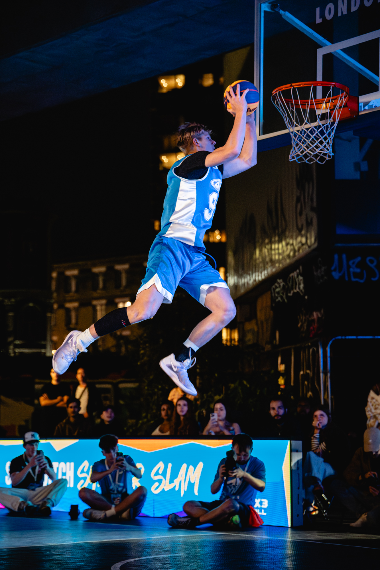 Cam Hazzard rising to the rim at a night dunk event