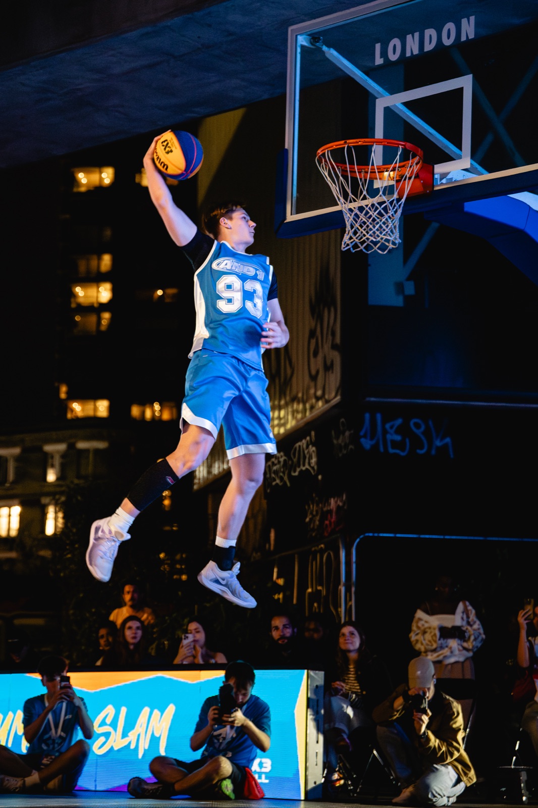 Cam Hazzard rising for a one hand dunk in an AND1 jersey at Rise 3x3 London