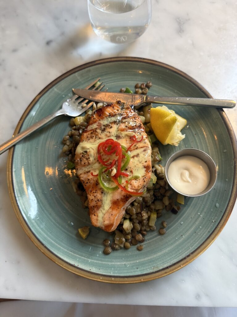 Grilled salmon with lentils and vegetables, one of the clean recovery meals before Group A
