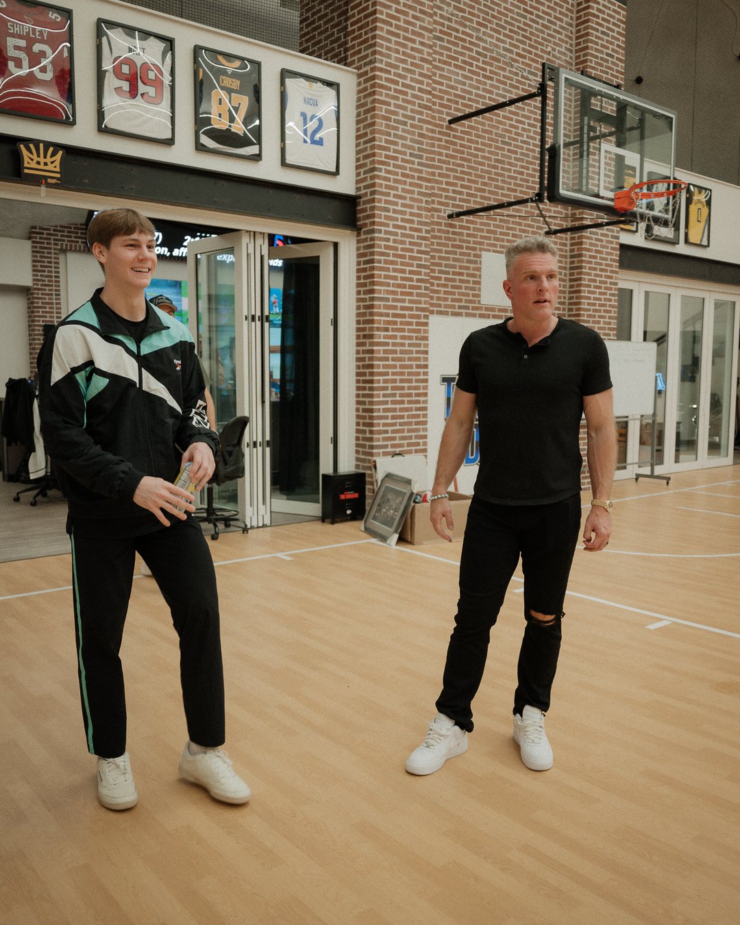 Cam Hazzard and Pat McAfee on the Thunderdome court before the dunks
