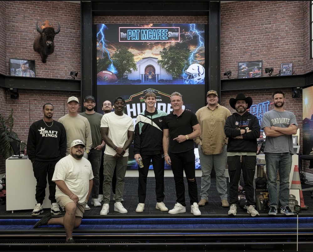 Cam Hazzard with Pat McAfee and the show crew on the Thunderdome set
