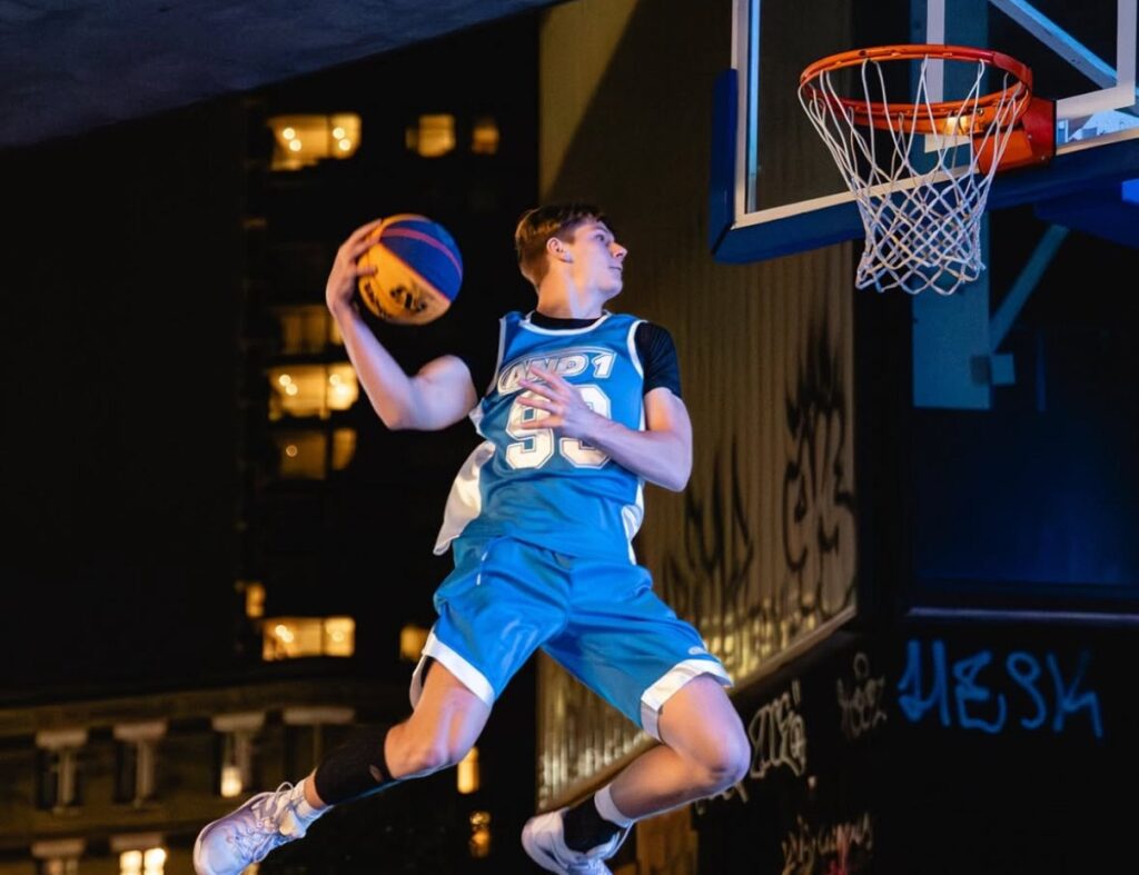 Cam Hazzard rising for a dunk with the ball cocked back
